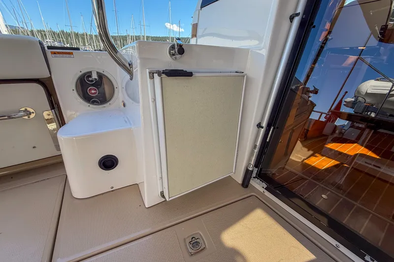  Yacht Photos Pics 2018 Ranger Tugs R-29 S boat deck with storage compartment and door.