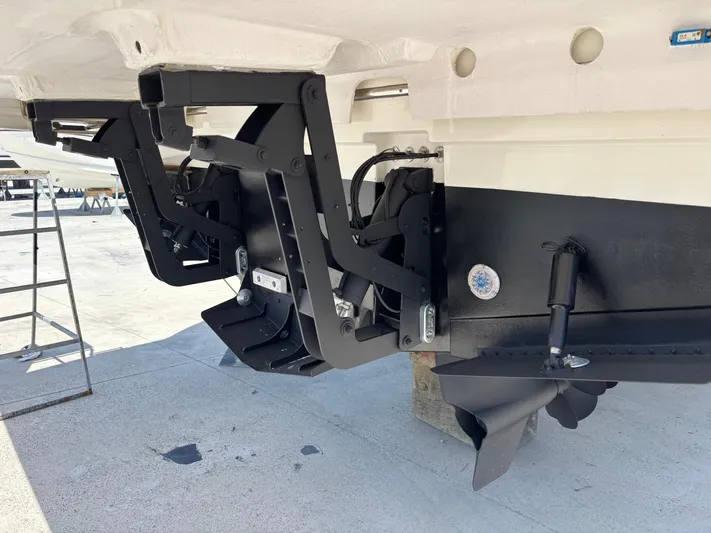  Yacht Photos Pics Stern view of 2020 Jeanneau Prestige 460 boat with trim tabs and propellers.