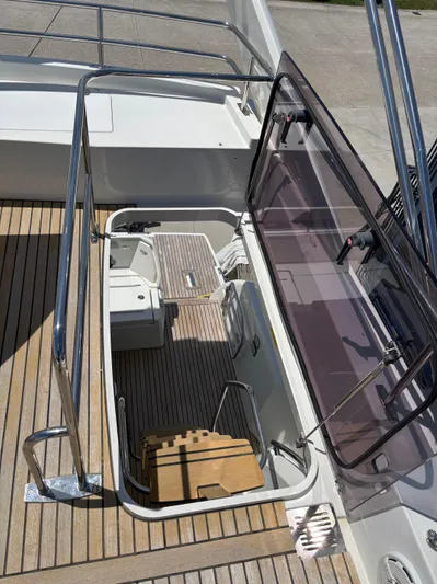  Yacht Photos Pics Jeanneau Prestige 460 yacht deck with open hatch, showcasing interior details, 2020 model.