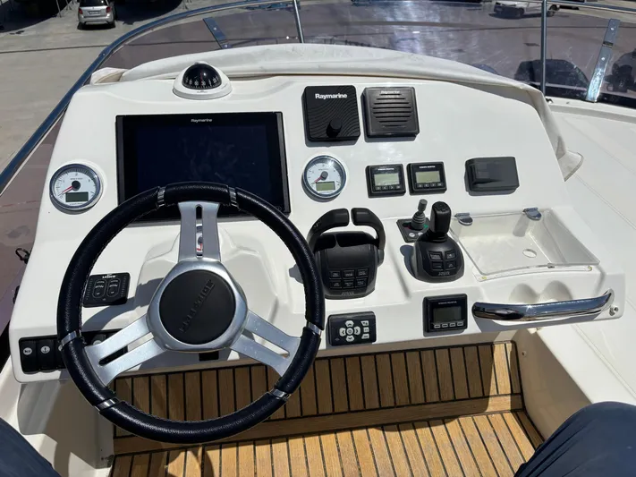 Yacht Photos Pics Helm of 2020 Jeanneau Prestige 460 yacht with modern navigation controls.