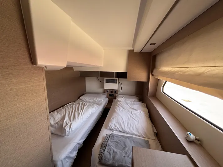  Yacht Photos Pics Twin cabin interior of 2020 Jeanneau Prestige 460 yacht, featuring cozy beds and modern design.