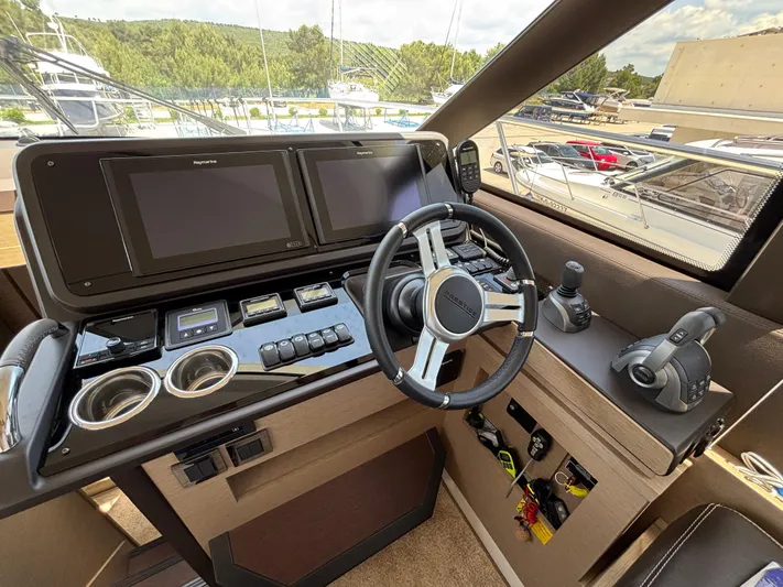  Yacht Photos Pics Helm of 2020 Jeanneau Prestige 460 yacht with modern navigation controls.