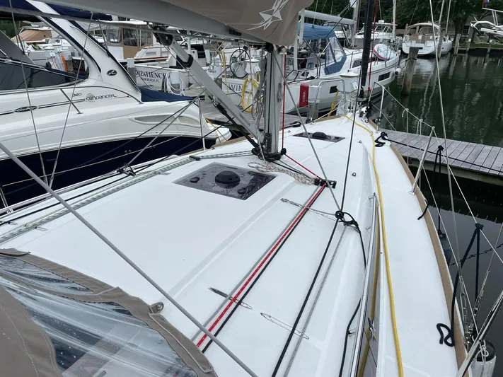  Yacht Photos Pics 2023 Jeanneau Sun Odyssey 349 sailboat docked, showcasing sleek deck design and rigging.