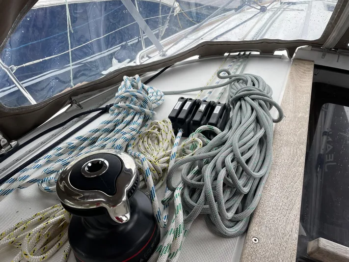  Yacht Photos Pics 2023 Jeanneau Sun Odyssey 349 sailboat deck with ropes and winch.