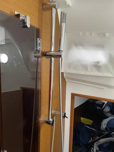  Yacht Photos Pics 2023 Jeanneau Sun Odyssey 349 yacht interior shower with chrome fixtures.
