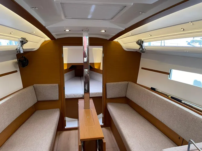  Yacht Photos Pics 2023 Jeanneau Sun Odyssey 349 interior with cozy seating and modern design.