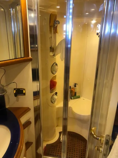  Yacht Photos Pics Luxurious bathroom in a 2004 Azimut 55 yacht with modern shower and elegant fixtures.