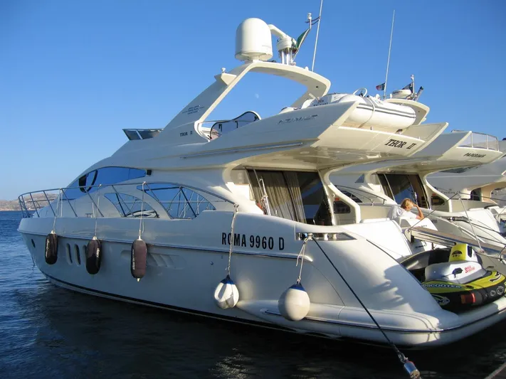  Yacht Photos Pics 2004 Azimut 55 yacht docked, featuring sleek design and luxurious amenities.