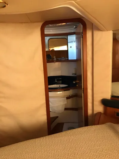  Yacht Photos Pics Interior view of 2004 Azimut 55 yacht bathroom with wooden accents.