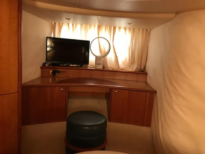  Yacht Photos Pics Interior of 2004 Azimut 55 yacht with TV, desk, and stool.