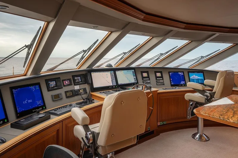 Crossed Sabre Yacht Photos Pics Pilothouse of 2006 Burger Trideck yacht with advanced navigation systems and panoramic windows.