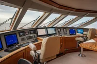 Pilothouse of 2006 Burger Trideck yacht with advanced navigation systems and panoramic windows.