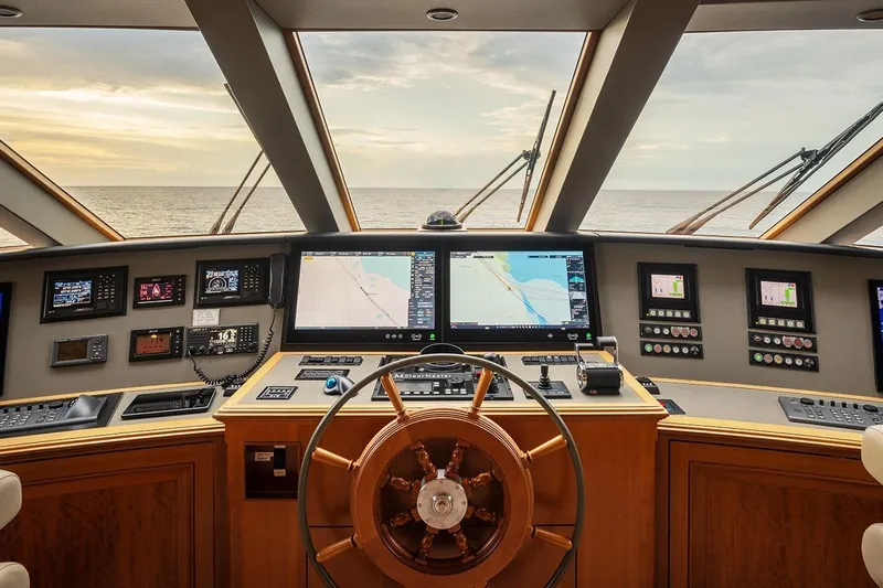 Crossed Sabre Yacht Photos Pics Bridge of 2006 Burger Trideck yacht with navigation screens and steering wheel.