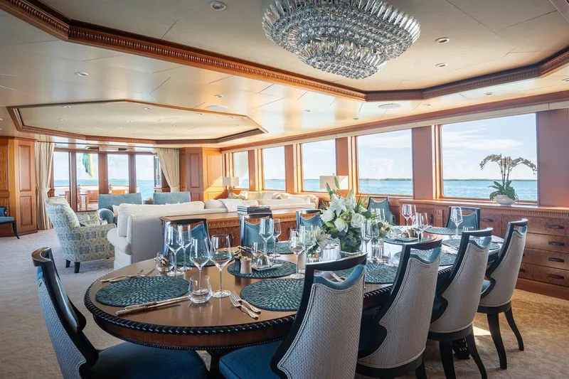 Crossed Sabre Yacht Photos Pics Luxurious dining area on 2006 Burger Trideck yacht with ocean views and elegant decor.