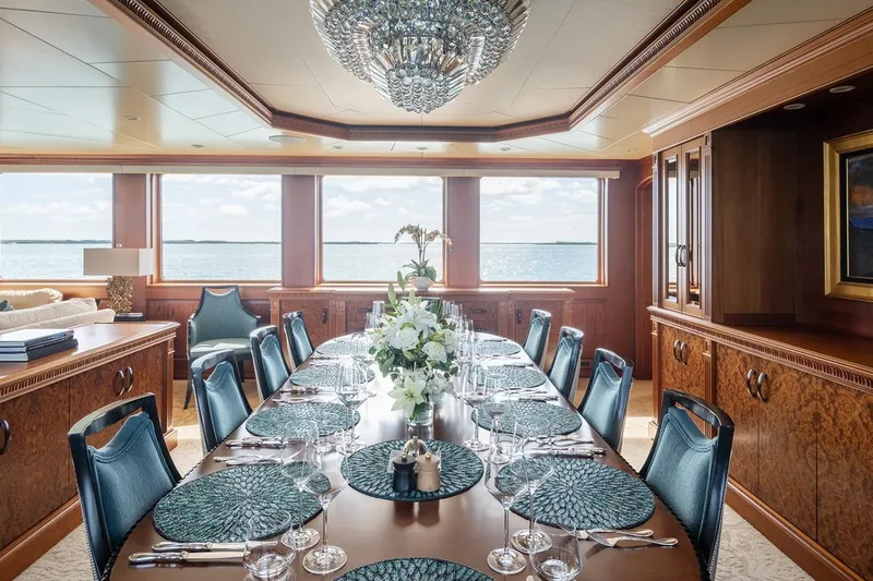Crossed Sabre Yacht Photos Pics Luxurious dining room on 2006 Burger Trideck yacht with elegant table setting and ocean view.