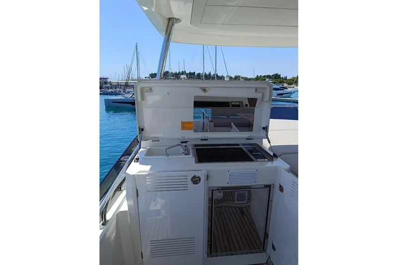  Yacht Photos Pics Prestige 590 yacht 2020 model with outdoor kitchen and marina view.