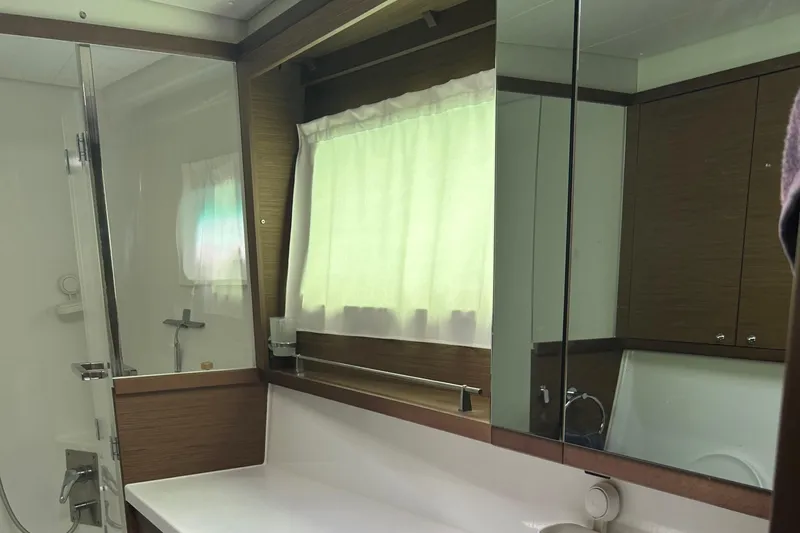 Habzie Yacht Photos Pics Luxurious bathroom in 2019 Lagoon 450 F Owner's Edition yacht, featuring modern fixtures and elegant design.