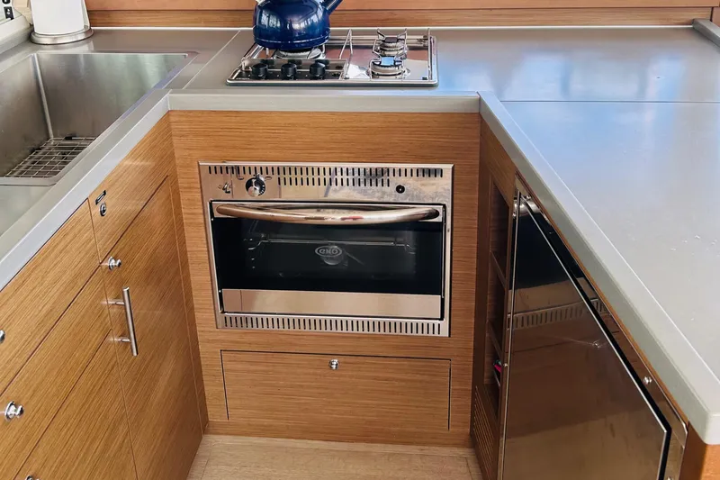 Habzie Yacht Photos Pics Modern kitchen in 2019 Lagoon 450 F yacht with stove, oven, and sink.