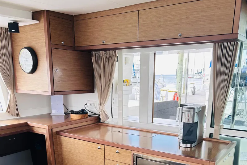 Habzie Yacht Photos Pics Interior of 2019 Lagoon 450 F Owner's Edition yacht with modern kitchen and ocean view.