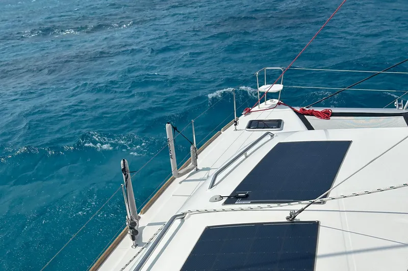 Habzie Yacht Photos Pics 2019 Lagoon 450 F Owner's Edition sailing on clear blue ocean waters.
