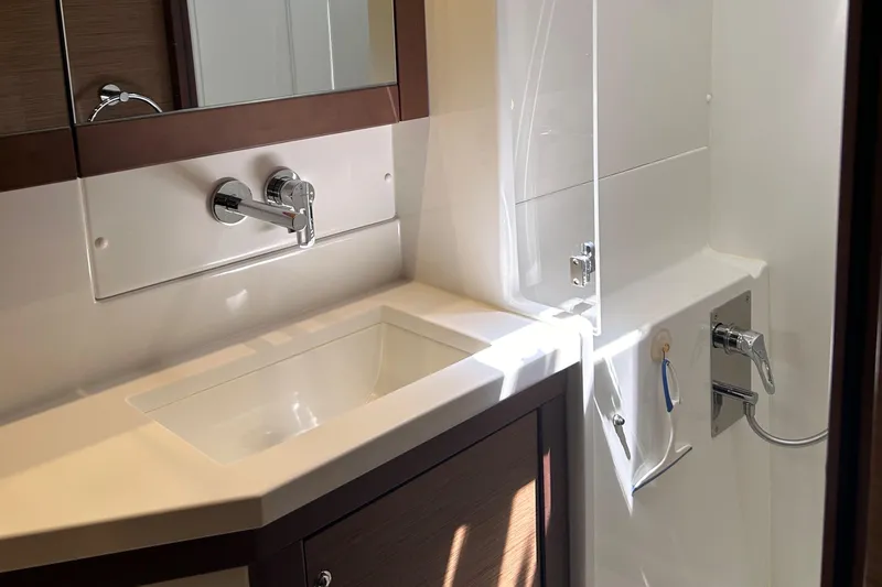 Habzie Yacht Photos Pics Luxurious bathroom in 2019 Lagoon 450 F Owner's Edition yacht, featuring modern sink and fixtures.