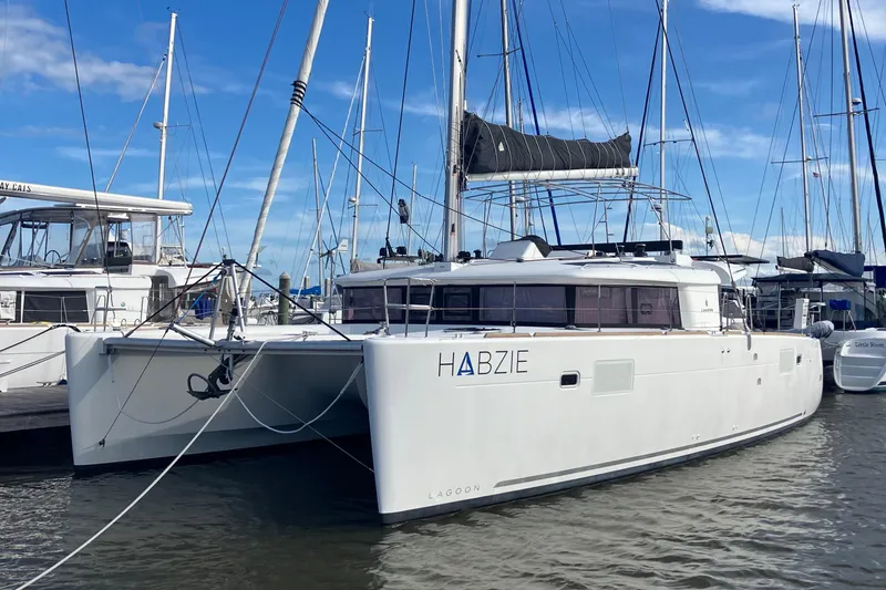 Habzie Yacht Photos Pics 2019 Lagoon 450 F Owner's Edition catamaran docked in marina.