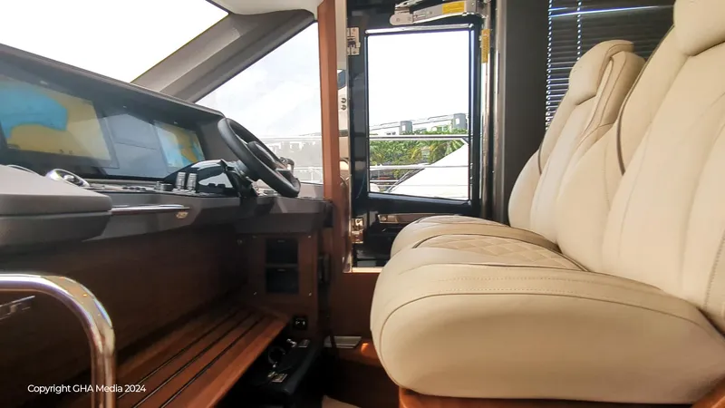  Yacht Photos Pics Interior of 2024 Princess F65 yacht with luxurious seating and modern dashboard.