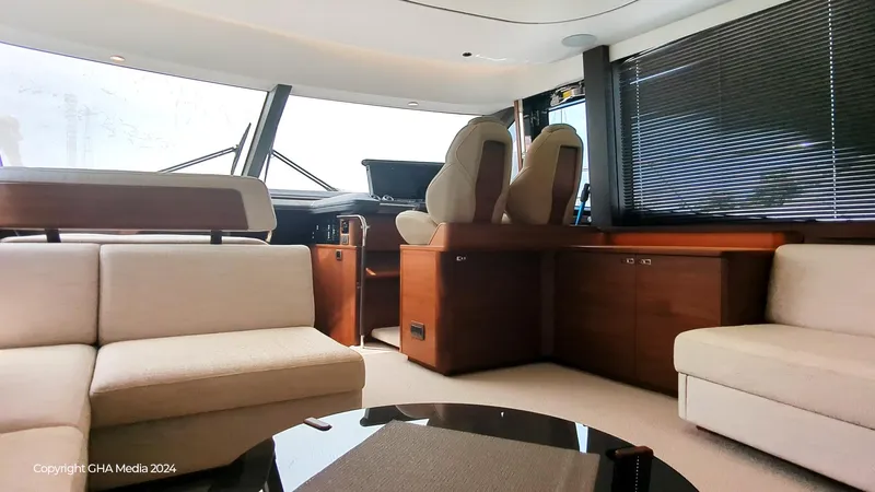 Yacht Photos Pics Luxurious interior of 2024 Princess F65 yacht with modern seating and helm station.