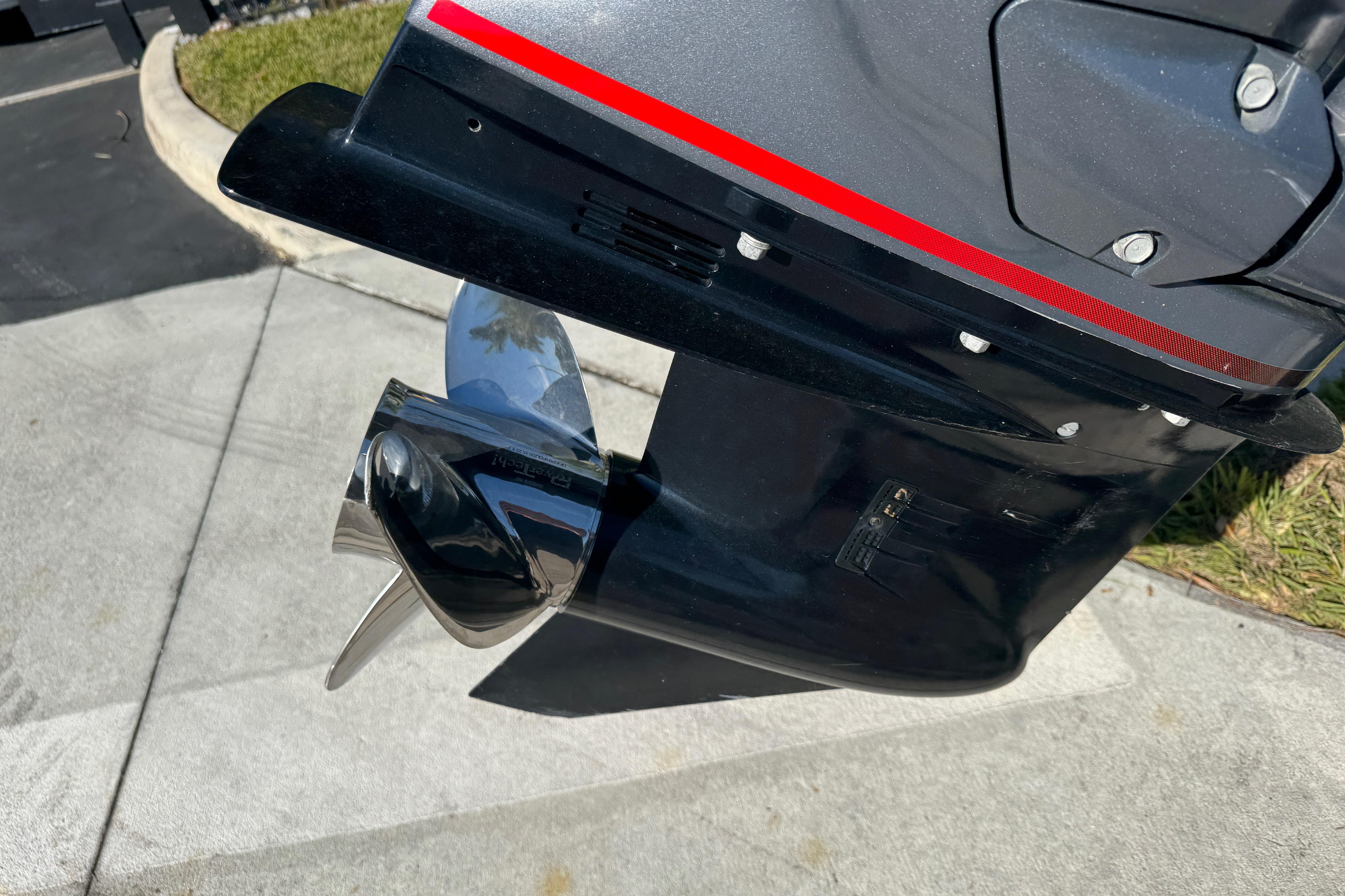 Close-up of 2025 Express H20 boat motor with shiny propeller.