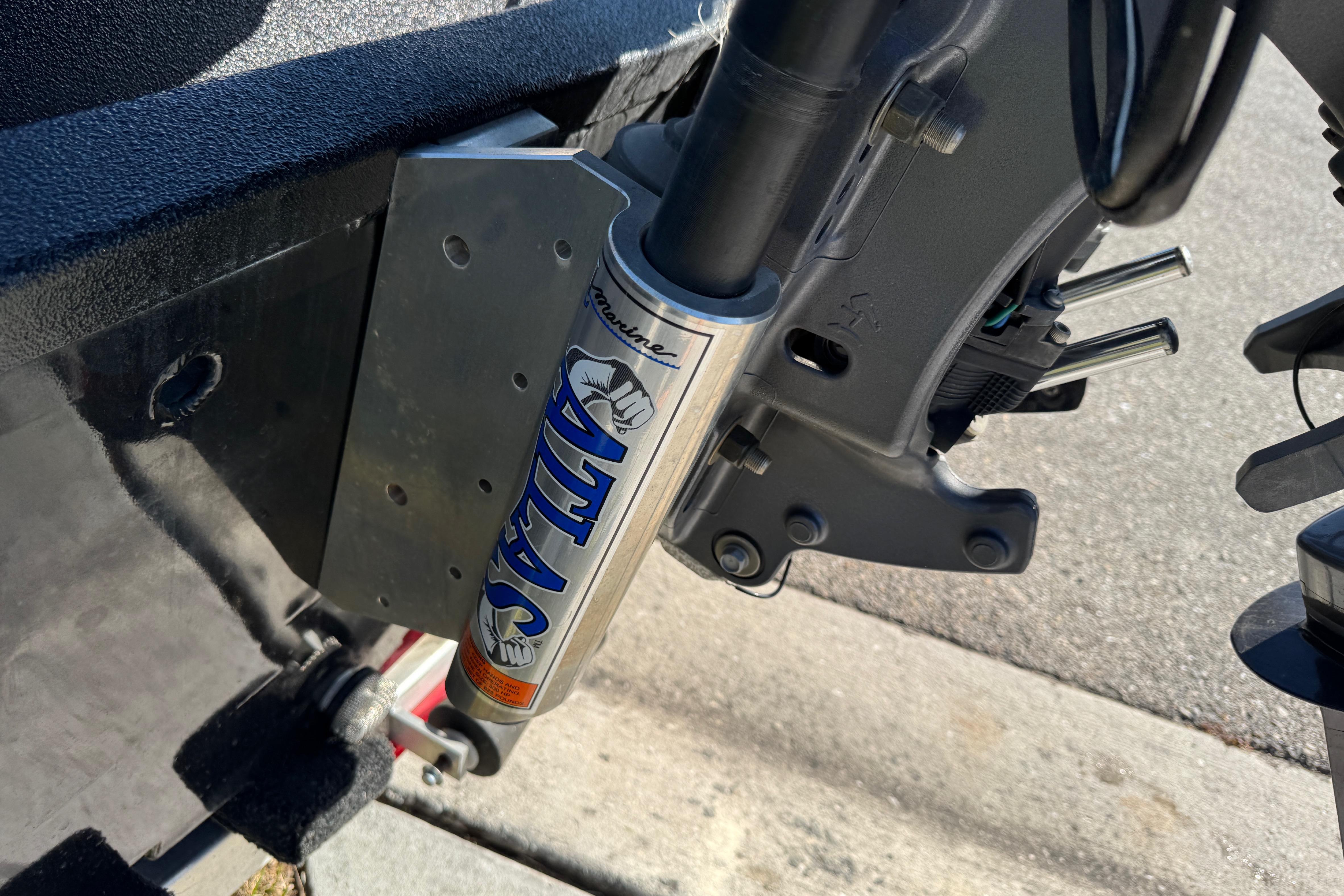 Outboard motor mount on Express H20, 2025 model, featuring Atlas hydraulic system.