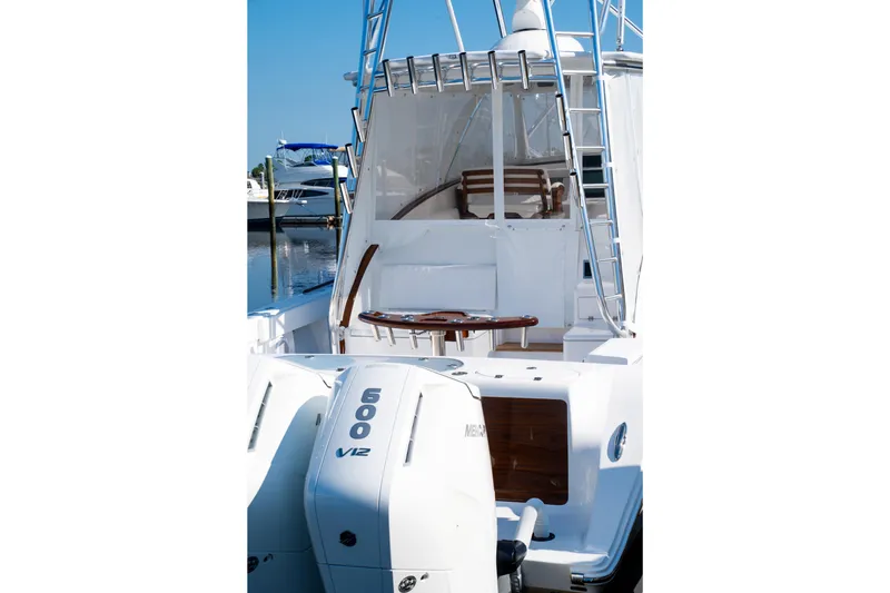 Front Runner Boatworks 47 Walkaround Yacht Photos Pics 2026 Front Runner 47WA boat with dual 600 V12 engines, docked at marina.