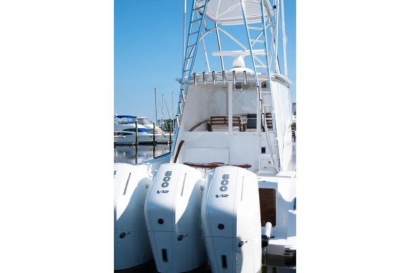 Front Runner Boatworks 47 Walkaround Yacht Photos Pics 2026 Front Runner 47WA boat with triple 600 V12 engines docked at marina.
