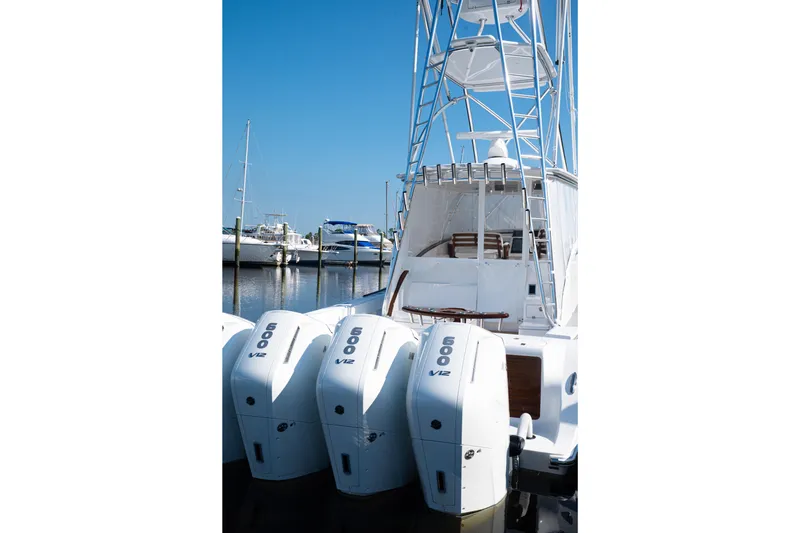 Front Runner Boatworks 47 Walkaround Yacht Photos Pics 2026 Front Runner 47WA boat with four powerful V12 engines docked at marina.