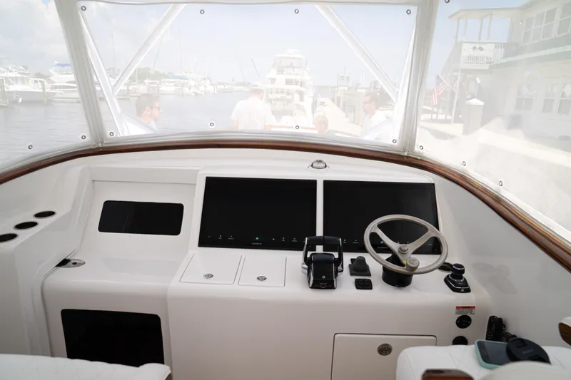 Front Runner Boatworks 47 Walkaround Yacht Photos Pics Helm of 2026 Front Runner 47WA boat with dual screens and steering wheel.