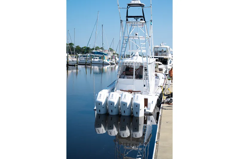 Front Runner Boatworks 47 Walkaround Yacht Photos Pics Front Runner 47WA 2026 boat docked with multiple outboard engines.