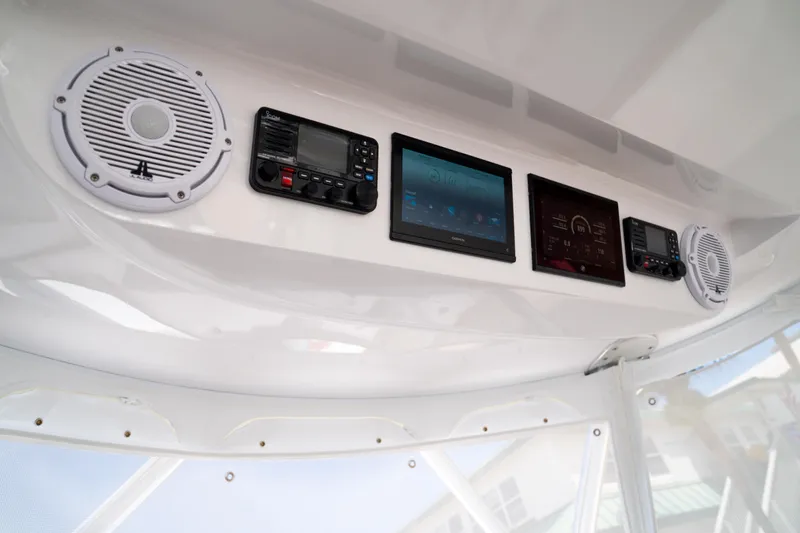 Front Runner Boatworks 47 Walkaround Yacht Photos Pics 2026 Front Runner 47WA boat dashboard with speakers and electronic displays.