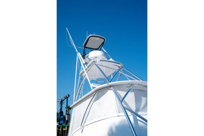 Front Runner Boatworks 47 Walkaround Yacht Photos Pics 2026 Front Runner 47WA boat tower against clear blue sky.