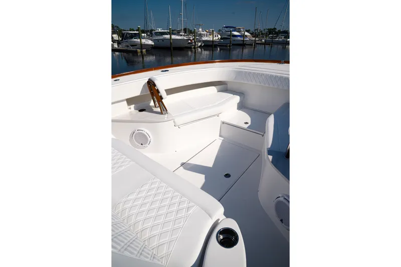 Front Runner Boatworks 47 Walkaround Yacht Photos Pics Front Runner 47WA 2026 boat interior with white seating and marina view.