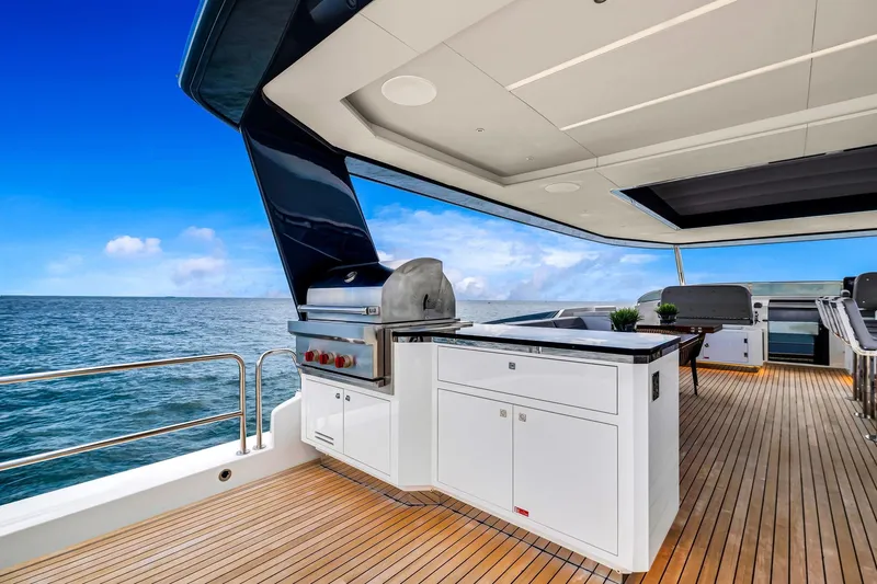  Yacht Photos Pics Luxurious 2021 Sirena 88 yacht deck with modern outdoor kitchen and ocean view.