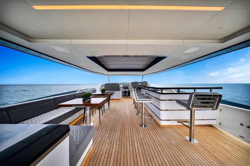  Yacht Photos Pics Luxurious 2021 Sirena 88 yacht deck with elegant seating and ocean view.