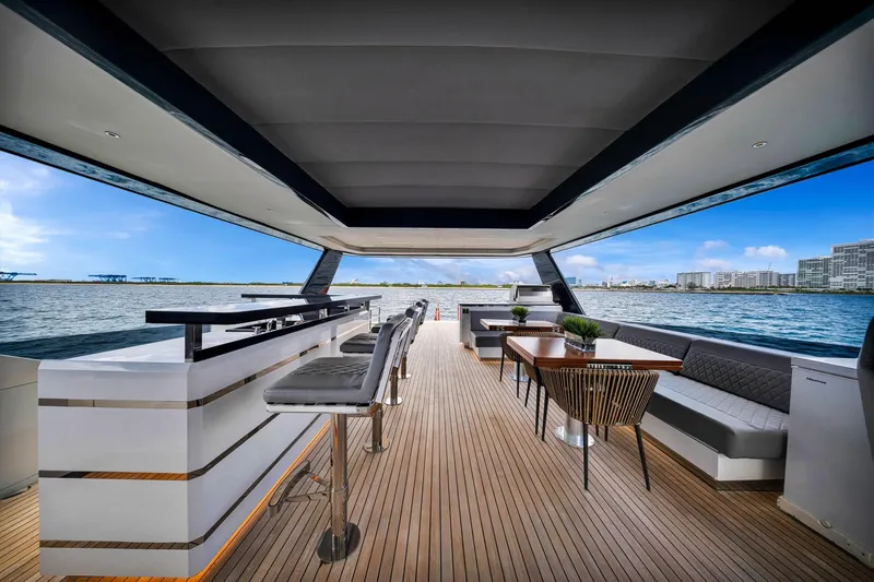  Yacht Photos Pics Luxurious 2021 Sirena 88 yacht interior with sleek bar, dining area, and ocean view.