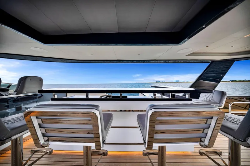  Yacht Photos Pics Luxury Sirena 88 yacht interior, 2021 model, featuring elegant seating and ocean view.