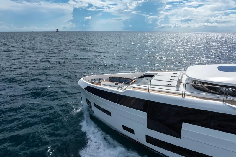  Yacht Photos Pics Luxury Sirena 88 yacht cruising on open sea under a bright sky, 2021 model.