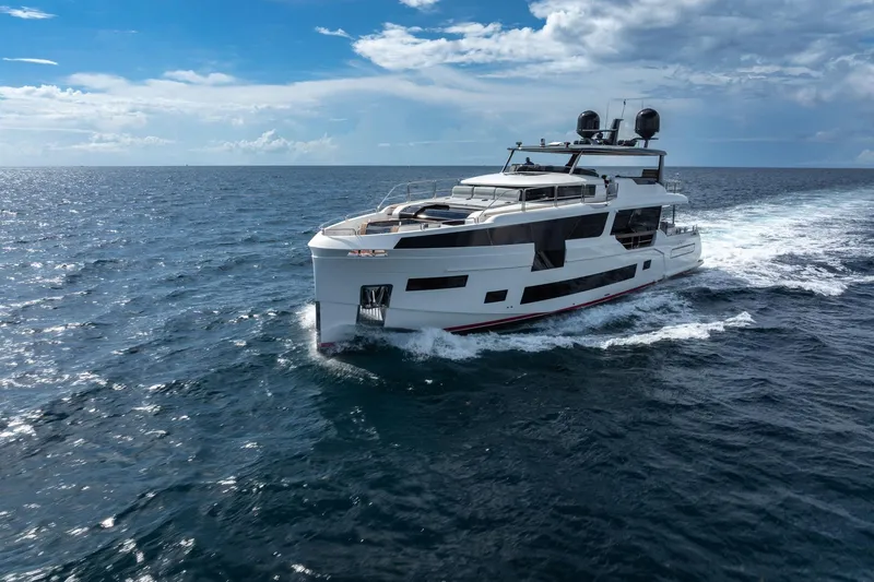  Yacht Photos Pics Luxury Sirena 88 yacht cruising on open sea under clear blue sky, 2021 model.