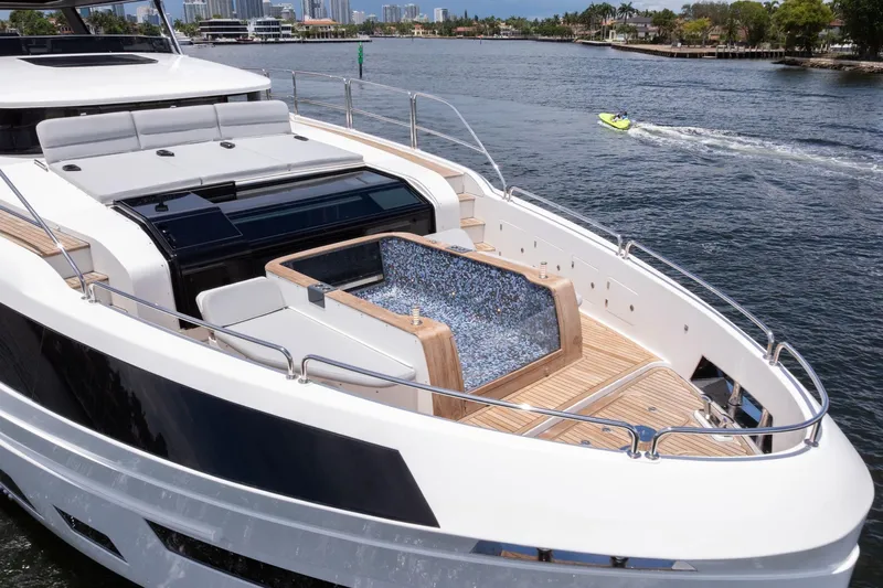  Yacht Photos Pics Luxury Sirena 88 yacht with sleek design and spacious deck, cruising on a sunny day.