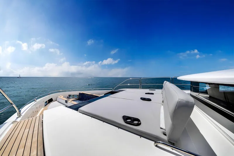  Yacht Photos Pics Luxurious 2021 Sirena 88 yacht deck with ocean view under clear blue sky.