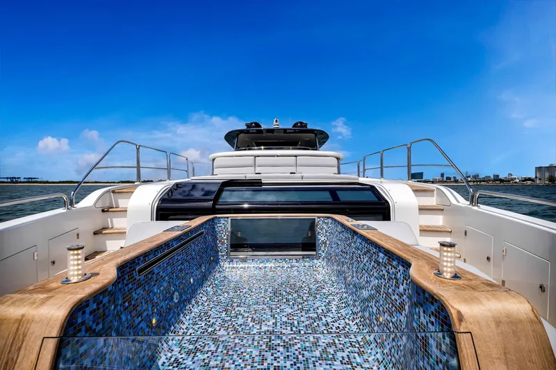  Yacht Photos Pics Luxurious 2021 Sirena 88 yacht with mosaic-tiled deck and stunning ocean view.