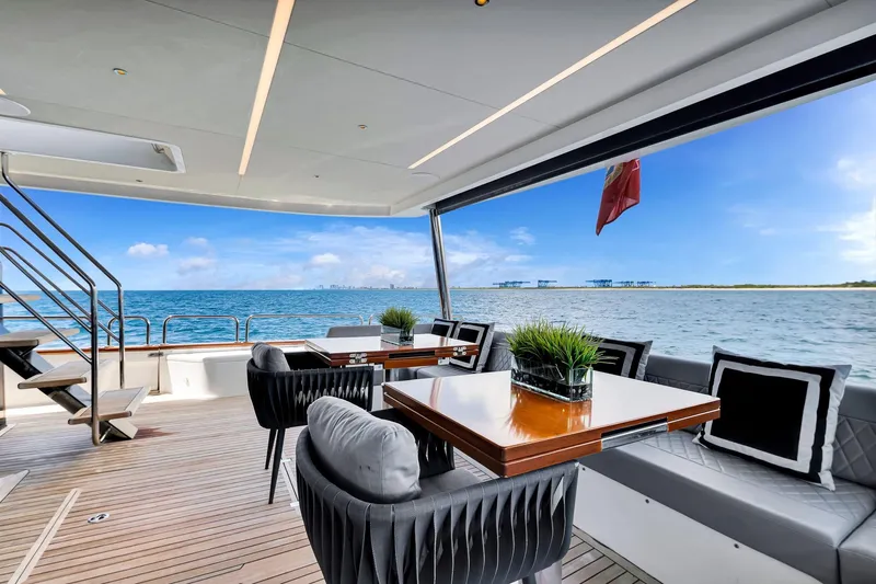  Yacht Photos Pics Luxurious 2021 Sirena 88 yacht deck with elegant seating and ocean view.