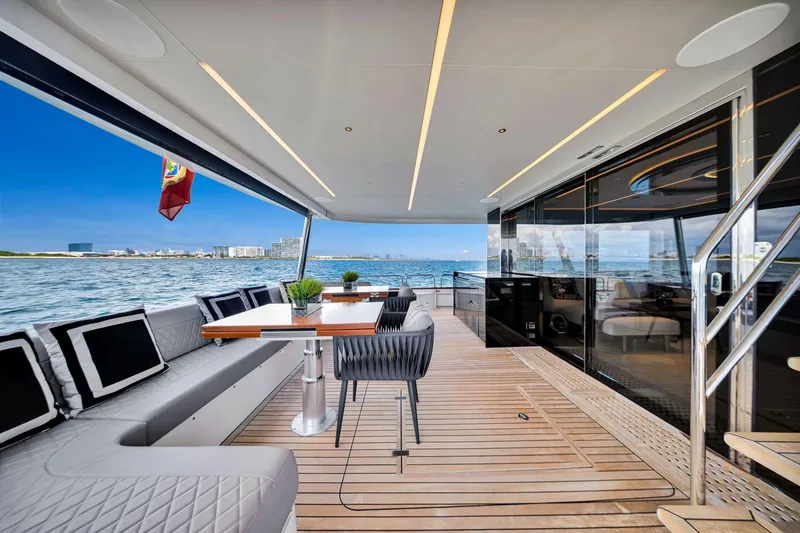  Yacht Photos Pics Luxurious 2021 Sirena 88 yacht deck with elegant seating and ocean view.