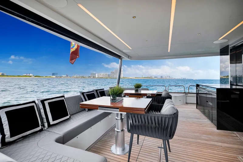  Yacht Photos Pics Luxurious 2021 Sirena 88 yacht deck with elegant seating and ocean view.
